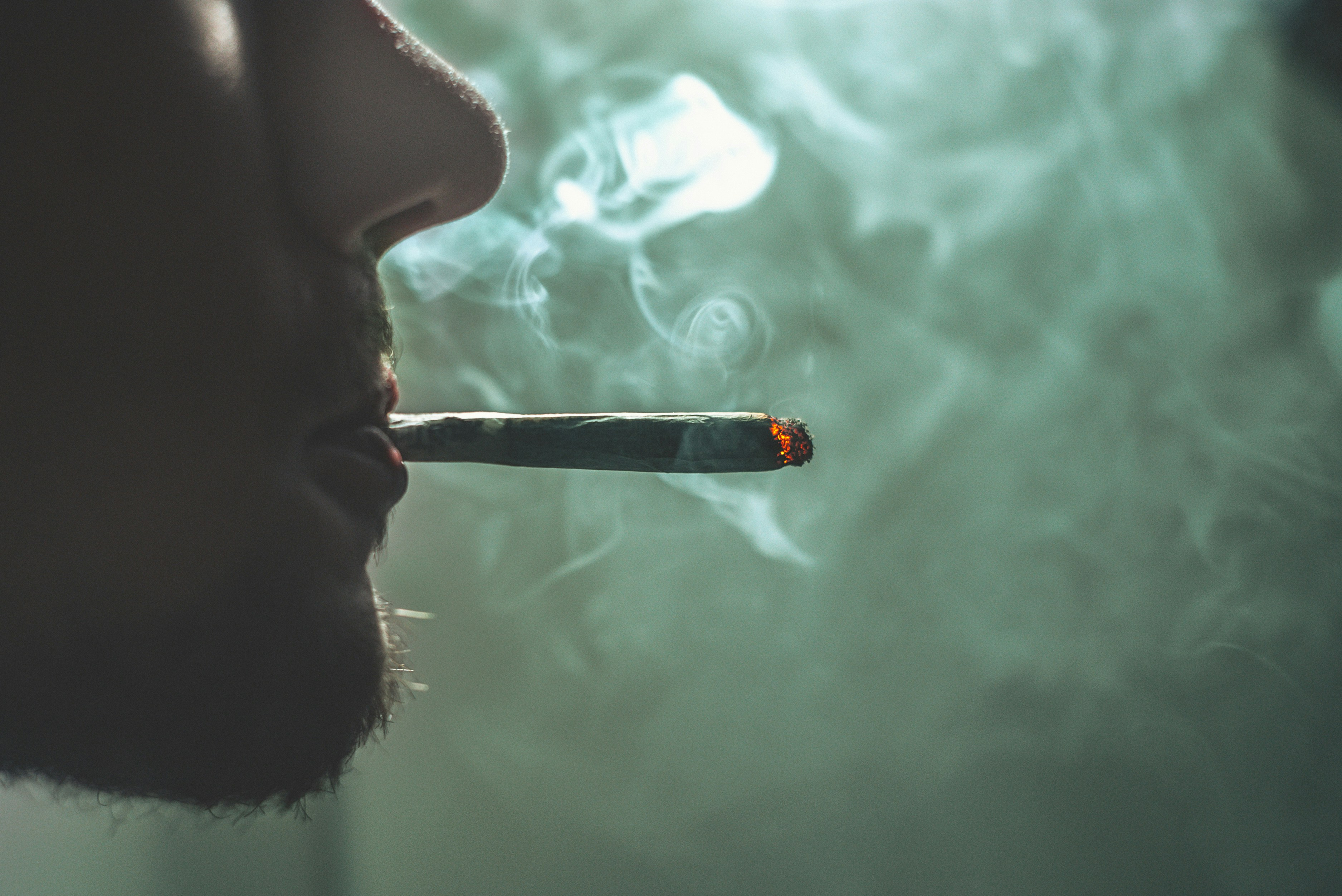 https://unsplash.com/photos/person-smoking-6ScKApDyAMQ